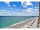 Beautiful beach view from a high-rise, complete with sunbathers, umbrellas, and the calming ocean waves at 912 N Waccamaw Dr. # 904, Garden City Beach, SC 29576