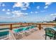 Spacious deck featuring beach chairs and a table with stunning ocean views, perfect for relaxing or entertaining at 912 N Waccamaw Dr. # 904, Garden City Beach, SC 29576