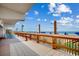 View from oceanfront deck with chairs, railing, and beach showers at 912 N Waccamaw Dr. # 904, Garden City Beach, SC 29576