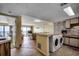 Efficient kitchenette space featuring appliances and access to the balcony at 912 N Waccamaw Dr. # 904, Garden City Beach, SC 29576