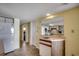 Cozy kitchenette adjacent to the dining area with modern appliances at 912 N Waccamaw Dr. # 904, Garden City Beach, SC 29576