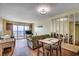 Inviting living and dining area with a sliding glass door to balcony and ocean views at 912 N Waccamaw Dr. # 904, Garden City Beach, SC 29576