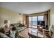 Bright living area with ocean views from the balcony at 912 N Waccamaw Dr. # 904, Garden City Beach, SC 29576