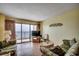 Living area showcasing a sliding glass door to the balcony with ocean views at 912 N Waccamaw Dr. # 904, Garden City Beach, SC 29576