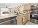 Kitchen with stainless-steel appliances, granite countertops, and wood cabinets at 9820 Queensway Blvd. # 502, Myrtle Beach, SC 29572