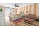 Serene bedroom with a king-size bed, balcony access, and ample natural light at 9820 Queensway Blvd. # 502, Myrtle Beach, SC 29572