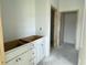 Bathroom vanity being installed with natural wood doorframes, new construction at 1021 Jase Dr., Longs, SC 29568