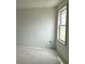 A well-lit bedroom featuring a window offering views and natural light to the living space at 1021 Jase Dr., Longs, SC 29568