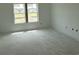 A light-filled bedroom with a large window offering pleasant views of the surrounding landscape at 1021 Jase Dr., Longs, SC 29568