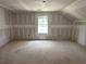 A bright bedroom features natural light and ample space, awaiting personalization and design at 1045 Jase Dr., Longs, SC 29568