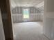 Spacious bedroom with natural light streaming through the window, awaiting your personal touch at 1045 Jase Dr., Longs, SC 29568