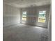 Bright bedroom filled with natural light from two windows at 1045 Jase Dr., Longs, SC 29568