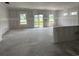 Unfinished living area with large windows and sliding glass door, ready for customization and personal touches at 1045 Jase Dr., Longs, SC 29568