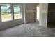 Bright living room with large windows, waiting for personalization to create a comfortable and inviting space at 1045 Jase Dr., Longs, SC 29568