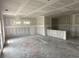 Expansive living room featuring white drywall and plenty of natural light at 1045 Jase Dr., Longs, SC 29568