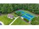 Aerial view of community tennis courts surrounded by mature trees at 106 Cypress Creek Dr., Murrells Inlet, SC 29576