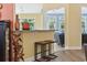 Modern bar with leather chairs and granite countertops looking into the living room at 106 Cypress Creek Dr., Murrells Inlet, SC 29576