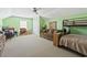 This bedroom is spacious and has neutral carpet, a bunkbed, and comfortable seating at 106 Cypress Creek Dr., Murrells Inlet, SC 29576
