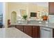 Kitchen with granite countertops, stainless steel dishwasher, and a connection to the living room at 106 Cypress Creek Dr., Murrells Inlet, SC 29576
