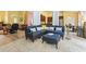 Open living room with tile floors, comfortable seating, and views into the dining room and kitchen at 106 Cypress Creek Dr., Murrells Inlet, SC 29576