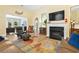 Bright living room with a fireplace and built-in cabinets, offering a cozy and inviting atmosphere at 106 Cypress Creek Dr., Murrells Inlet, SC 29576
