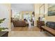 Spacious open-concept living room with wood floors and a seamless flow into the dining and living areas at 106 Cypress Creek Dr., Murrells Inlet, SC 29576