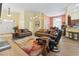 Spacious living area showcasing stylish furnishings, including leather sofas and a colorful area rug at 106 Cypress Creek Dr., Murrells Inlet, SC 29576