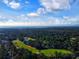 Aerial view of the property showcases the golf course and mature trees surrounding the home at 1073 Crooked Oak Dr., Pawleys Island, SC 29585