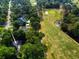 Aerial view features the home's proximity to the golf course and lush greenery in the community at 1073 Crooked Oak Dr., Pawleys Island, SC 29585