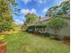 Expansive backyard with lush greenery, manicured landscaping, and an inviting outdoor area at 1073 Crooked Oak Dr., Pawleys Island, SC 29585