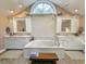 Bathroom featuring a large window above the garden tub, double sinks, and white cabinets at 1073 Crooked Oak Dr., Pawleys Island, SC 29585