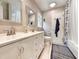 Bathroom with double sink vanity, decorative mirrors, and a shower-tub combination at 1073 Crooked Oak Dr., Pawleys Island, SC 29585