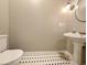 Bathroom featuring a pedestal sink and black and white tile floor at 1073 Crooked Oak Dr., Pawleys Island, SC 29585