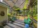 Inviting deck features shaded seating with views of the lush backyard, perfect for outdoor entertaining at 1073 Crooked Oak Dr., Pawleys Island, SC 29585