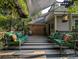 Striking deck has stylish striped floors, comfortable seating, and privacy-enhancing foliage at 1073 Crooked Oak Dr., Pawleys Island, SC 29585