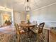 Cozy dining room with hardwood floors, a round wooden table, and elegant decor at 1073 Crooked Oak Dr., Pawleys Island, SC 29585