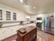 Spacious kitchen with stainless steel appliances and center island at 1073 Crooked Oak Dr., Pawleys Island, SC 29585