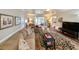 Spacious living room featuring hardwood floors, comfortable seating, and abundant natural light at 1073 Crooked Oak Dr., Pawleys Island, SC 29585