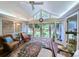 Bright sunroom with vaulted ceiling and large windows overlooking the backyard at 1073 Crooked Oak Dr., Pawleys Island, SC 29585
