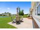 Back patio with dining set overlooking the lake at 1149 6Th Ave. S, North Myrtle Beach, SC 29582