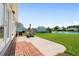 Open patio with outside dining set overlooking lawn and lake at 1149 6Th Ave. S, North Myrtle Beach, SC 29582