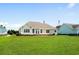 Wide open backyard with lake view from the back of the house at 1149 6Th Ave. S, North Myrtle Beach, SC 29582