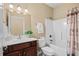 Well-lit bathroom featuring a vanity with a vessel sink and a shower-tub combination at 1149 6Th Ave. S, North Myrtle Beach, SC 29582
