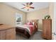 Guest bedroom with ceiling fan, window, and carpeted floor at 1149 6Th Ave. S, North Myrtle Beach, SC 29582