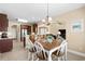 Open-concept dining area with charming table, breakfast bar, and seamlessly connected living spaces at 1149 6Th Ave. S, North Myrtle Beach, SC 29582