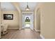 Inviting foyer with an open doorway, a neutral color scheme, and archways leading to other rooms at 1149 6Th Ave. S, North Myrtle Beach, SC 29582