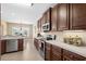 Beautiful kitchen with a modern microwave and stainless steel appliances near a light-filled dining area at 1149 6Th Ave. S, North Myrtle Beach, SC 29582