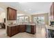 Open kitchen showcasing stainless steel dishwasher and seamless transition to the dining and living areas at 1149 6Th Ave. S, North Myrtle Beach, SC 29582