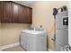 Functional laundry room equipped with a washer, dryer, and storage cabinets above at 1149 6Th Ave. S, North Myrtle Beach, SC 29582