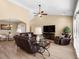 Spacious living area with hardwood floors, vaulted ceiling, comfortable seating, and a seamless connection to dining at 1149 6Th Ave. S, North Myrtle Beach, SC 29582